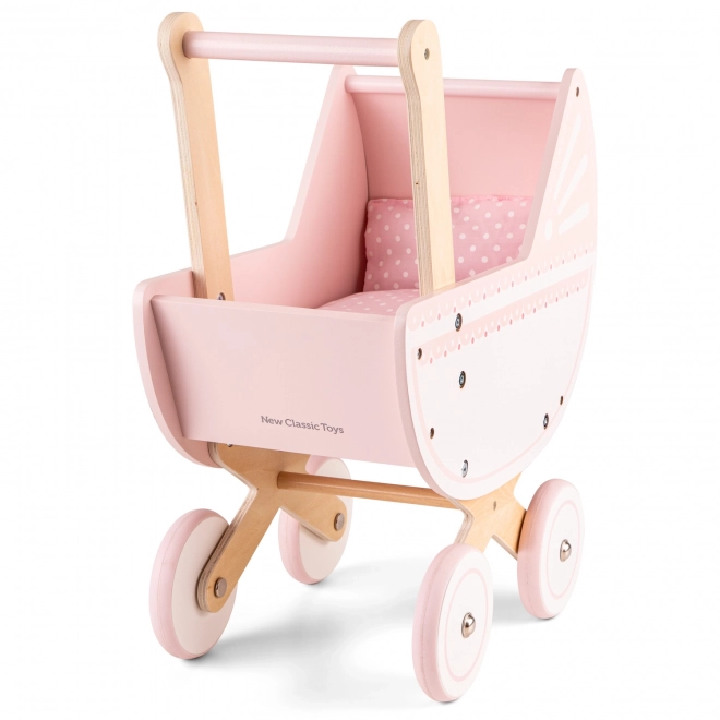 Chariot en bois rose pour poupées avec couverture