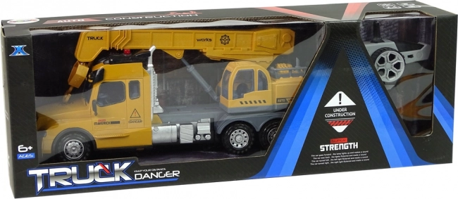 Camion jaune télécommandé avec grue et sons