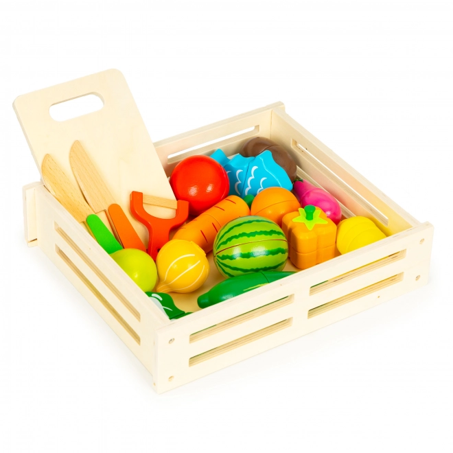 Fruits et légumes en bois à découper dans une boîte