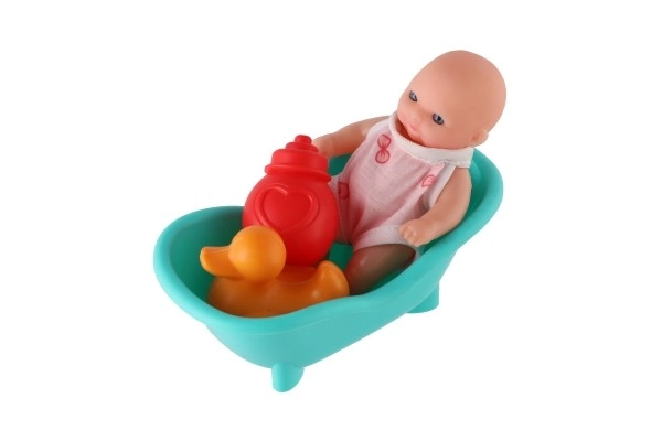 Poupée avec baignoire et accessoires