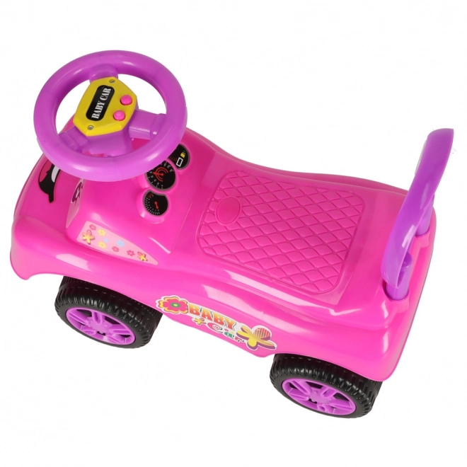 Petite voiture rose avec klaxon