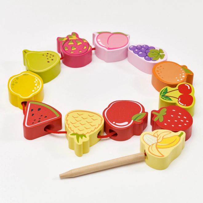 Blocs à enfiler en bois avec des fruits
