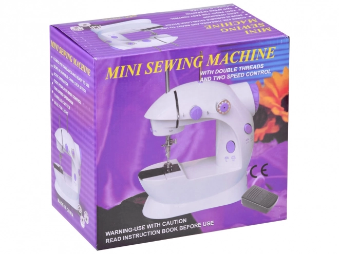 Mini machine à coudre à pédale