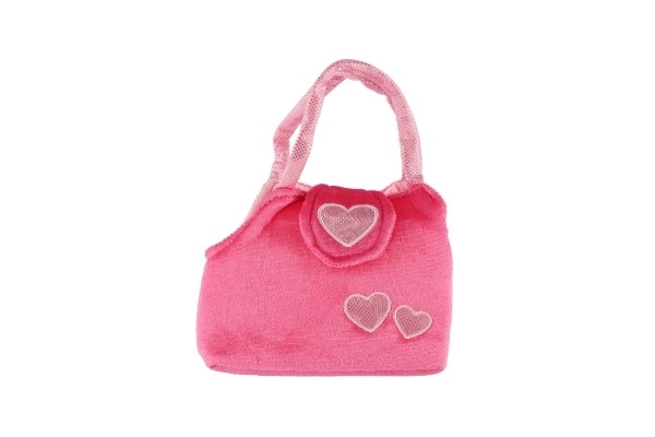 Caniche en peluche rose dans un sac à main