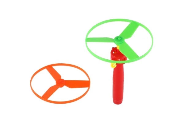 Toupie à élastique + lanceur plastique 9cm 2 couleurs en sachet