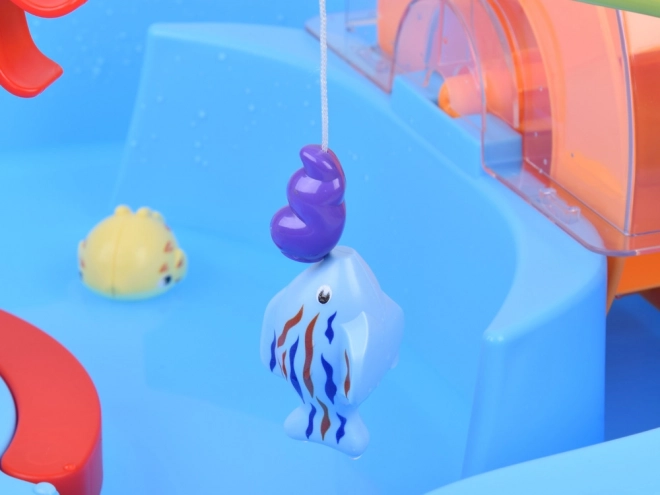 Table bleue d'eau avec roue à aubes et accessoires de pêche