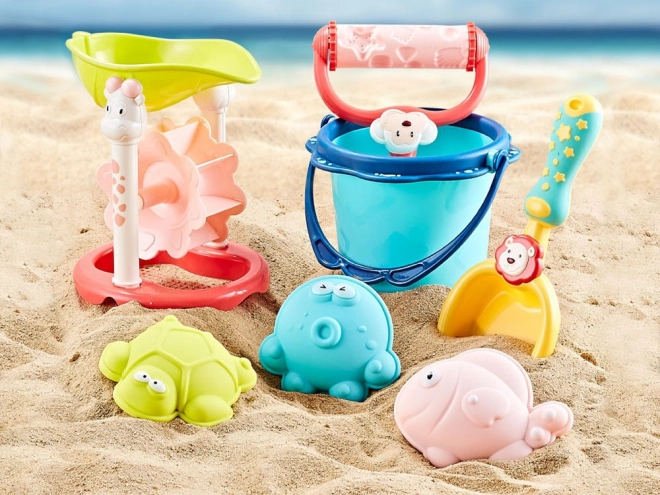 Ensemble coloré pour le sable avec seau et moules