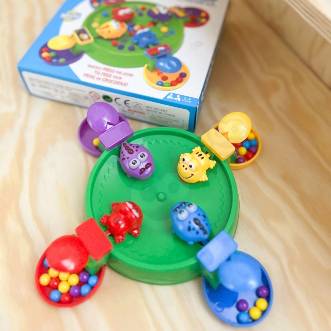 Jeu amusant de grenouilles joyeuses et crocodiles affamés