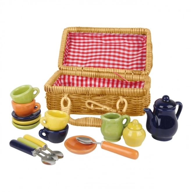 Petit panier de pique-nique avec vaisselle en céramique colorée