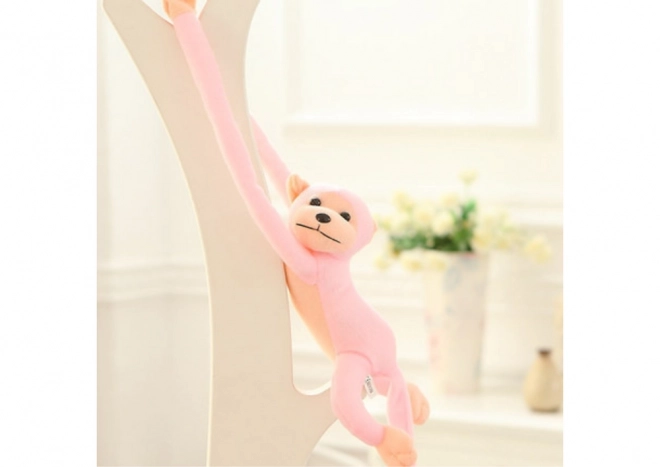 Mascotte en peluche singe avec son rose 60 cm