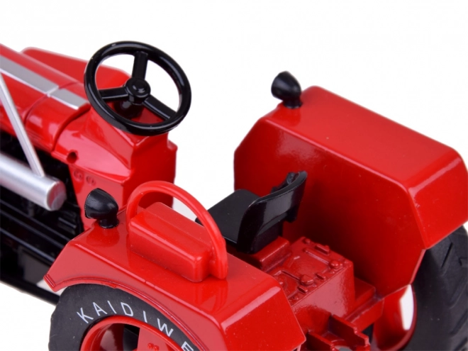 Tracteur métallique rouge avec roues en caoutchouc 1:18