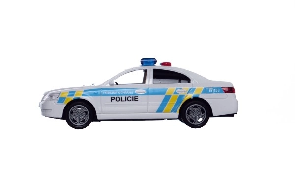 Voiture de police en plastique 15cm à piles avec son et lumière sur inertie en boîte 20x11x9cm
