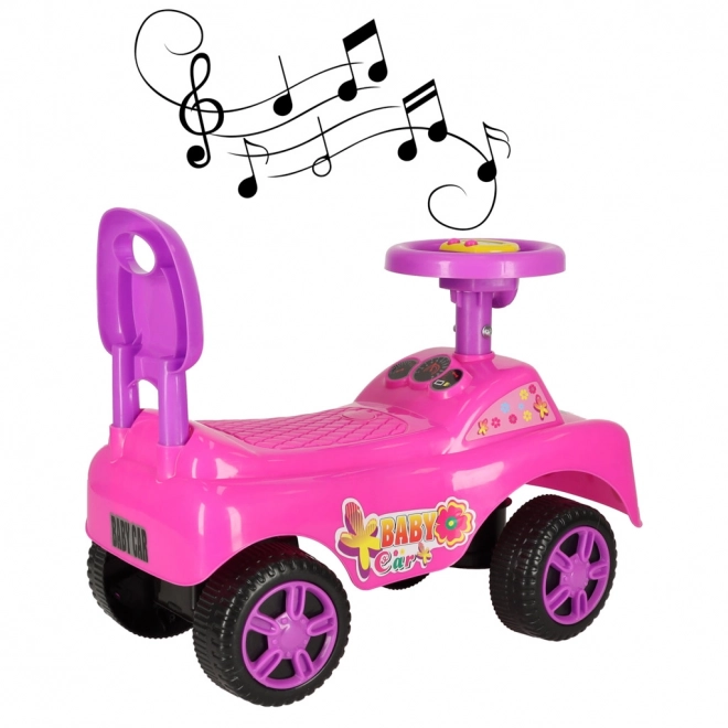 Petite voiture rose avec klaxon
