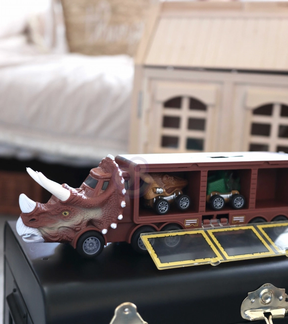 Camion dinosaure avec lanceur et petites voitures
