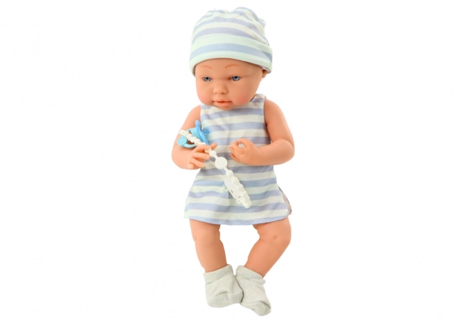 Poupée Bébé en Vêtement Blanc-Bleu avec Bonnet et Tétine
