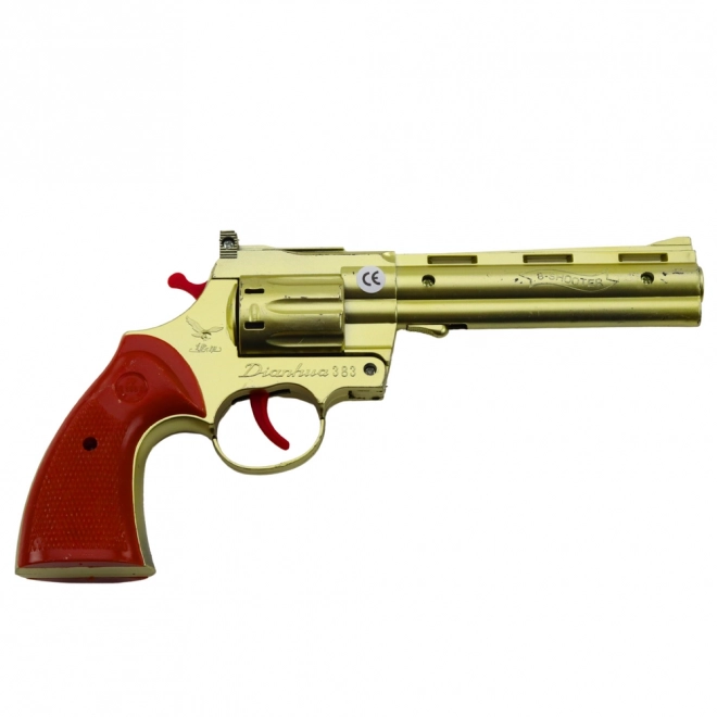 Revolver doré à capsules avec effet sonore