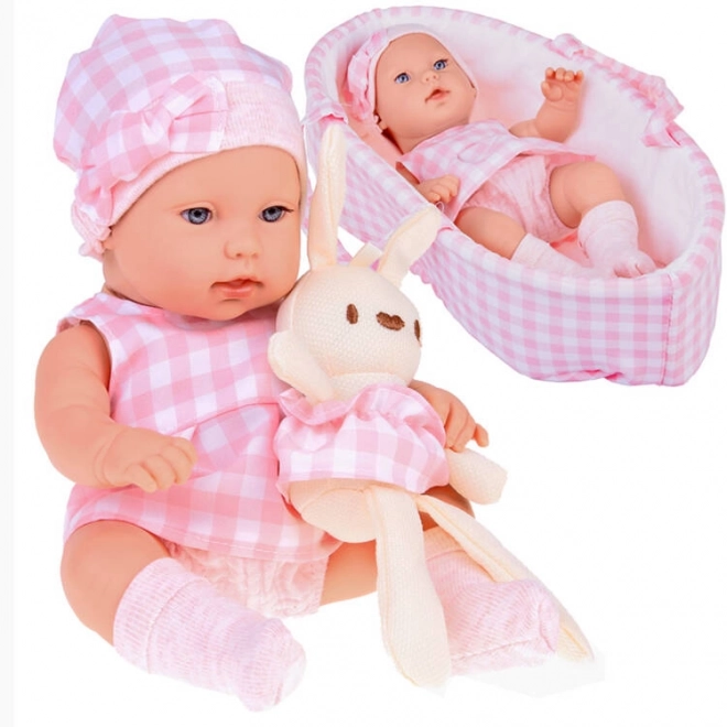 Poupée en tissu bébé nouveau-né avec bonnet rose