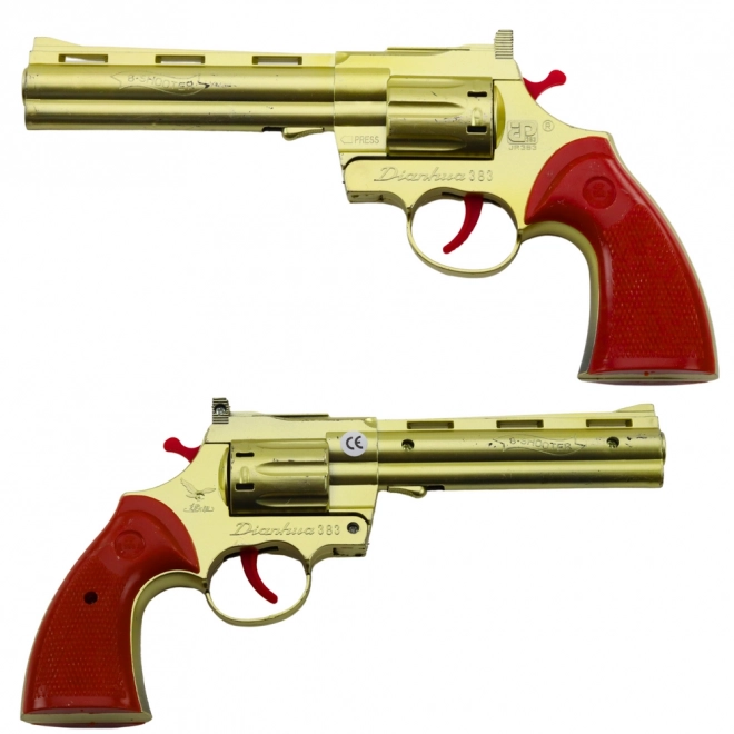 Revolver doré à capsules avec effet sonore