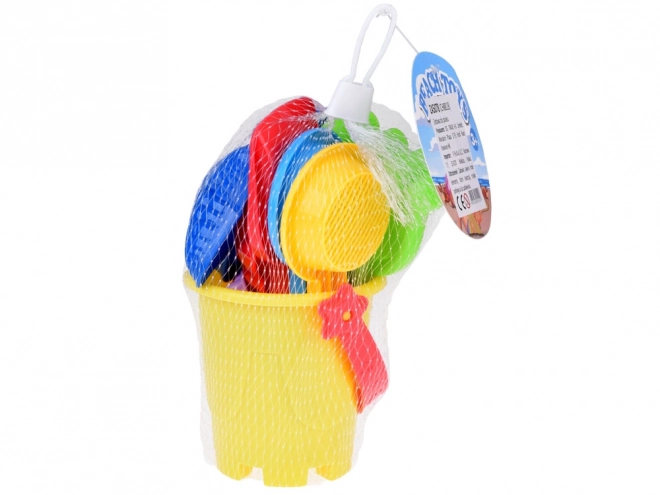Ensemble coloré de jouets de sable avec seau et moules