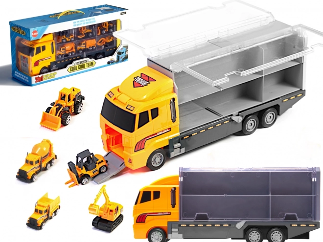 Camion avec petits véhicules de construction