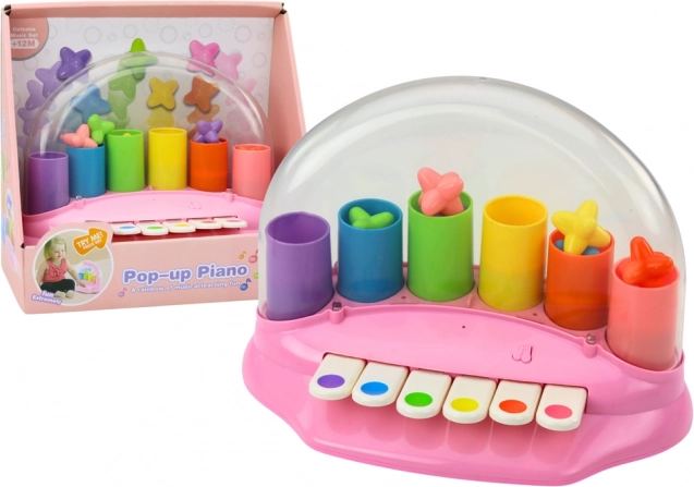 Petit piano interactif rose avec étoiles filantes