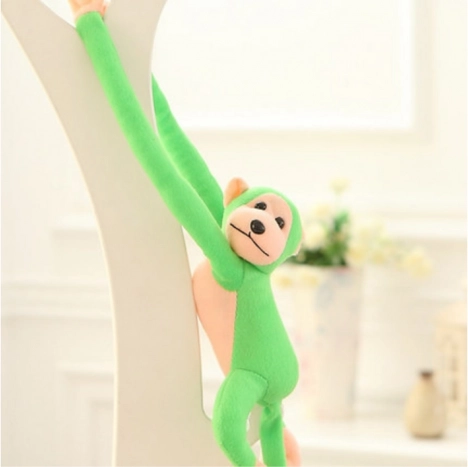 Singe en peluche avec son vert 60 cm