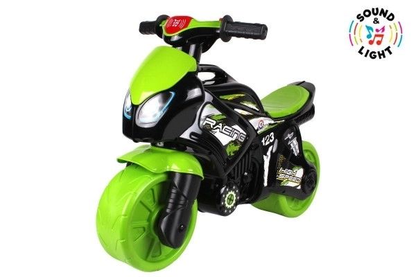 Trottinette moto vert-noir en plastique à batterie avec lumière et son, dans un sac 36x53x74cm