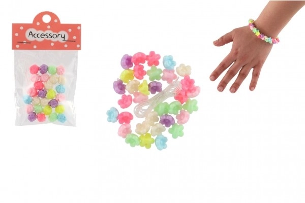 Perles en plastique petites fleurs avec ficelle 2 types dans un sachet 6,5x11x1cm