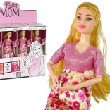 Poupée enceinte en robe rose à fleurs