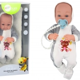 Poupée en tissu avec tétine et accessoires 35 cm