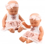 Poupée bébé endormie en robe rose avec dentelle et bandeau étoilé