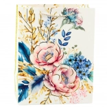 Sac cadeau avec des fleurs et des éléments dorés