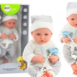 Poupée bébé réaliste en tenue blanc-gris avec bonnet et tétine