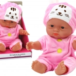 Petite poupée bébé en tenue rose avec bonnet de lapin