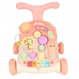 Trois-en-un : trotteur interactif et table d’éveil