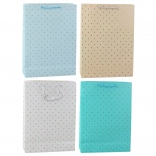 Sac cadeau avec des points dorés